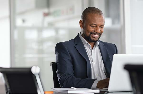 businessman doing home bankin from office